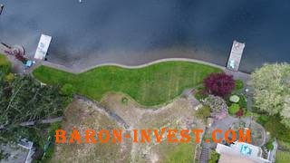 Lake front lot on Spanaway Lake on Enchanted Isle only $395,000